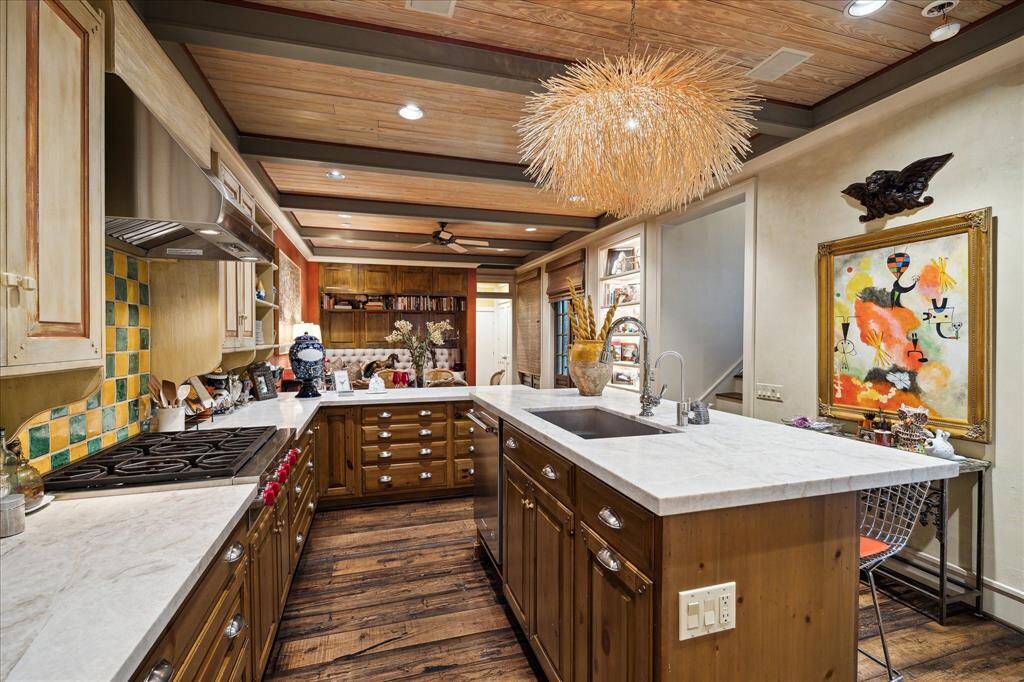 The open kitchen area features recent appliances including the gas cooktop, Wolfe vent hood, side by side refrigerator, 2 dishwashers and an ice maker. A great kitchen for entertaining or cooking at home!