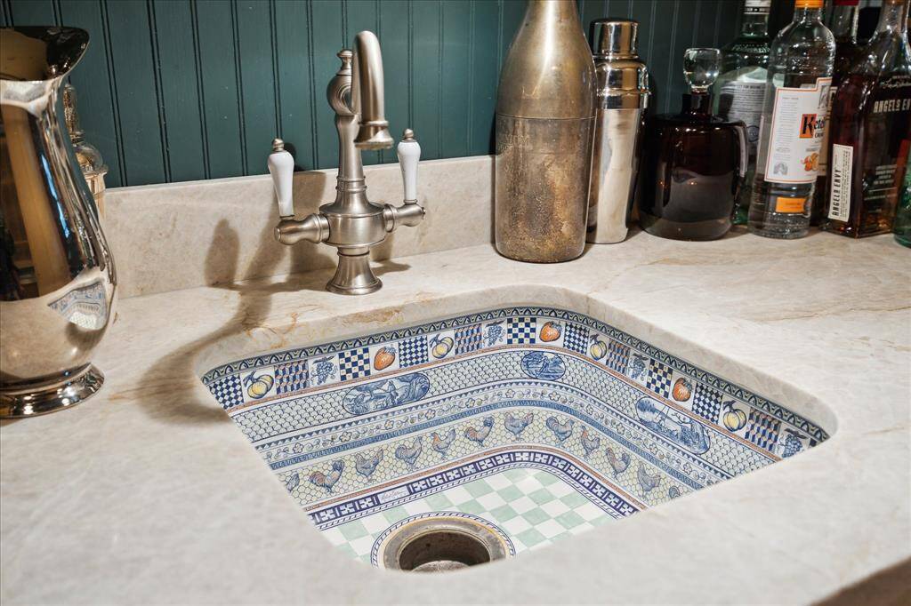 The bar sink is an example of the extra detail chosen in the finishes of the home.