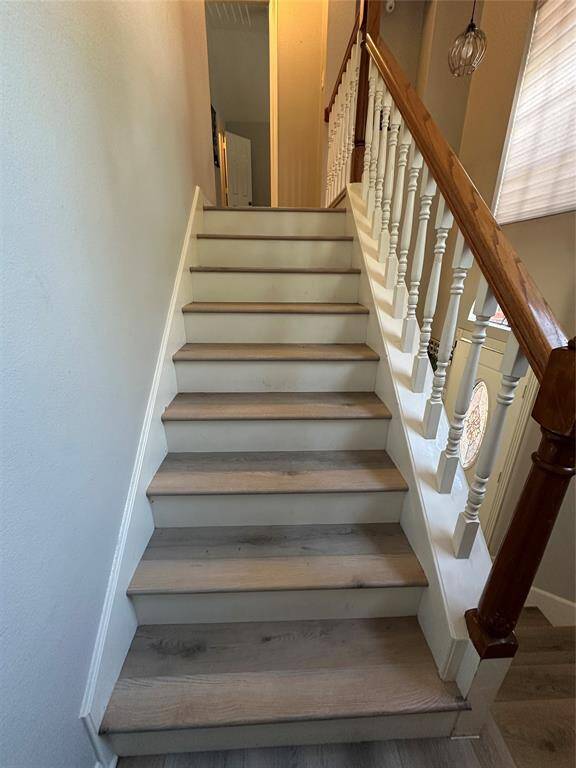 Vinyl plank flooring continues on staircase