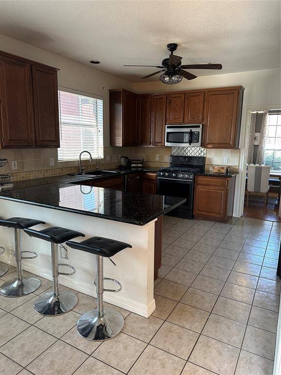 Kitchen with granite countertops in a timeless