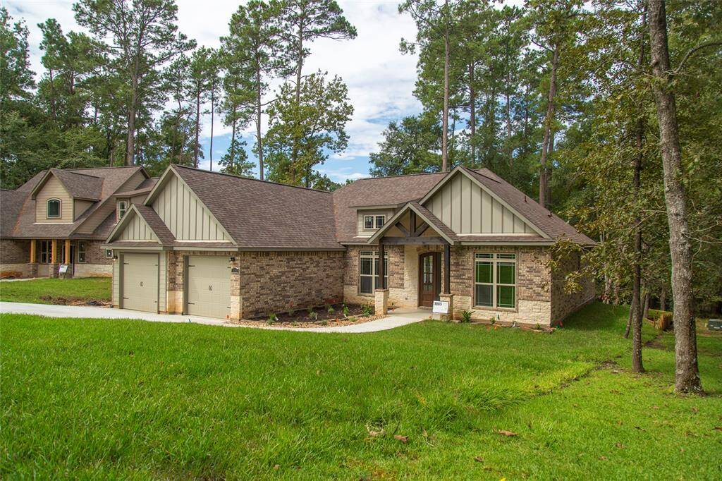 Another view of the brick and stone exterior. This is not the actual home, but a picture of a previously built home in the area.