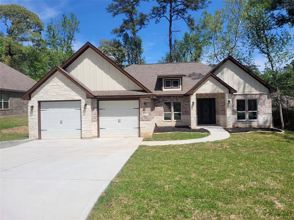 Another view of the brick and stone exterior. This is not the actual home, but a picture of a previously built home in the area.