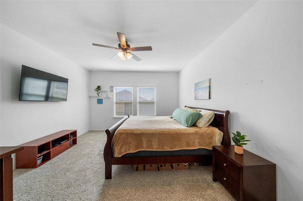 Step into your primary suite, overlooking the large back yard.