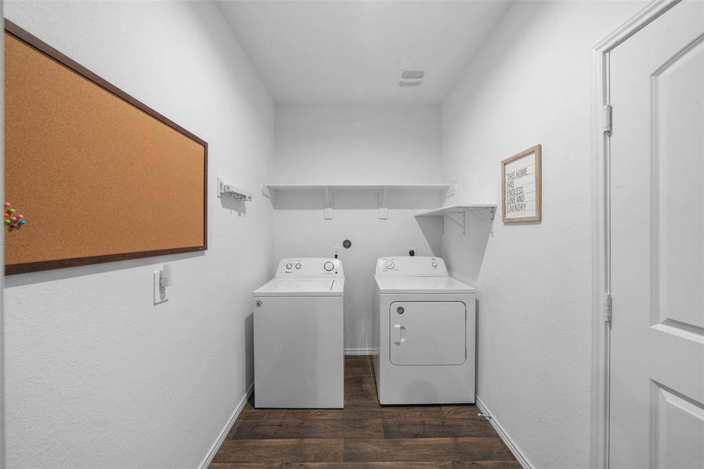 Head back downstairs and take a peek into the massive laundry room with access to the garage. No need to worry about muddy footprints all over your pristine carpets!