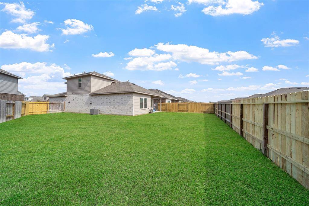 The corner location of this lot on the partial cut-de-sac lends to a HUGE back yard space.