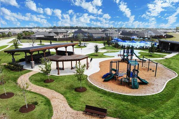 The community recreation center includes an amenity area, swimming pool, splash pad, community walking paths and a playground area.