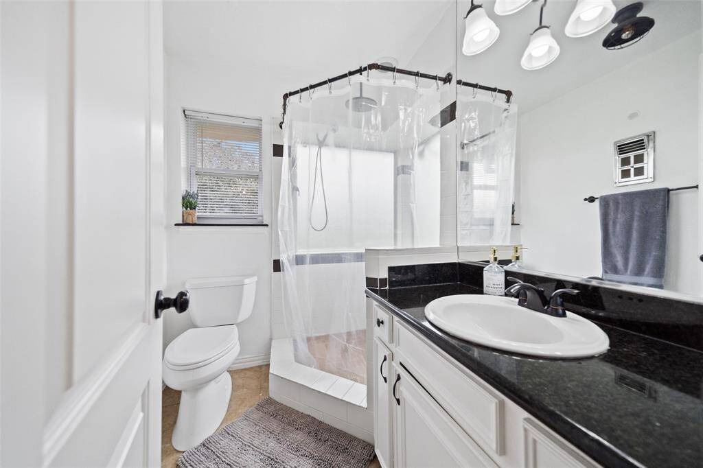 The primary bathroom offers a unique look and a beautiful large shower!