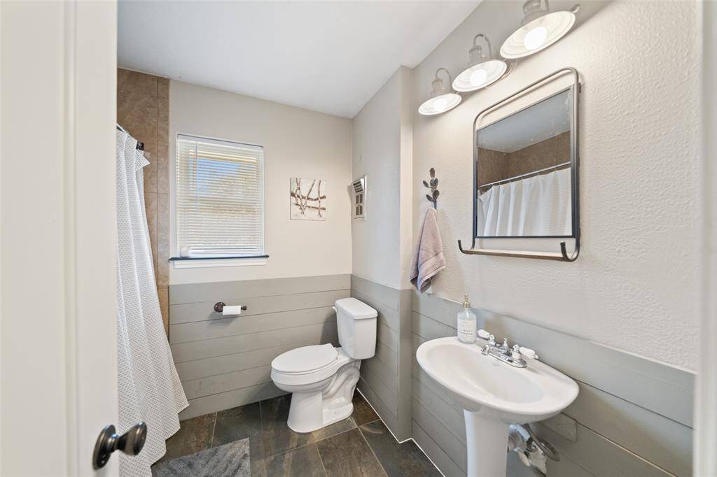 he secondary bathroom brings a rustic look and a beautiful, nice sized shower!