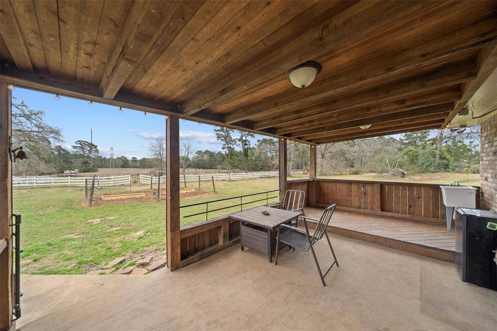 A covered back porch allows for a great space to gather!