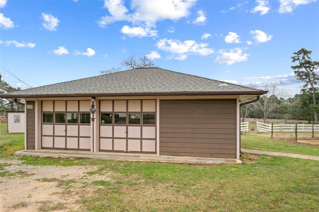 The detached 2 car garage is super convenient for keeping vehicles out of the weather!