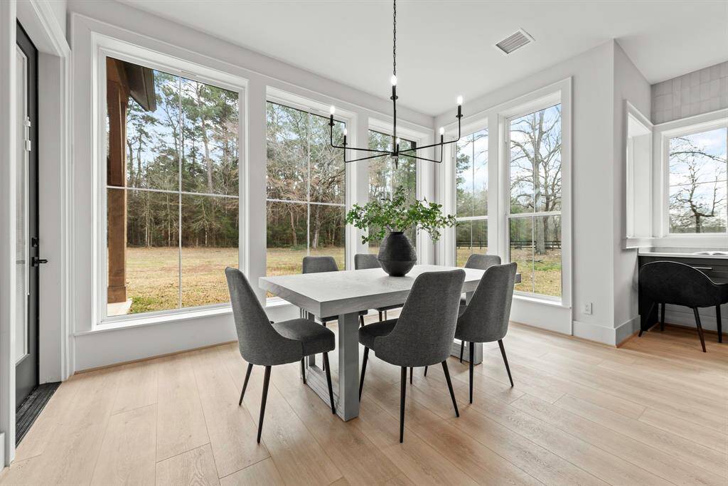 Breakfast space surrounded by windows.
