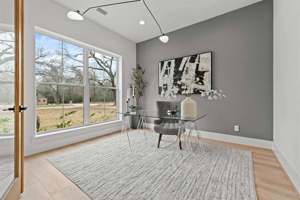 Front facing private study with glass French doors.