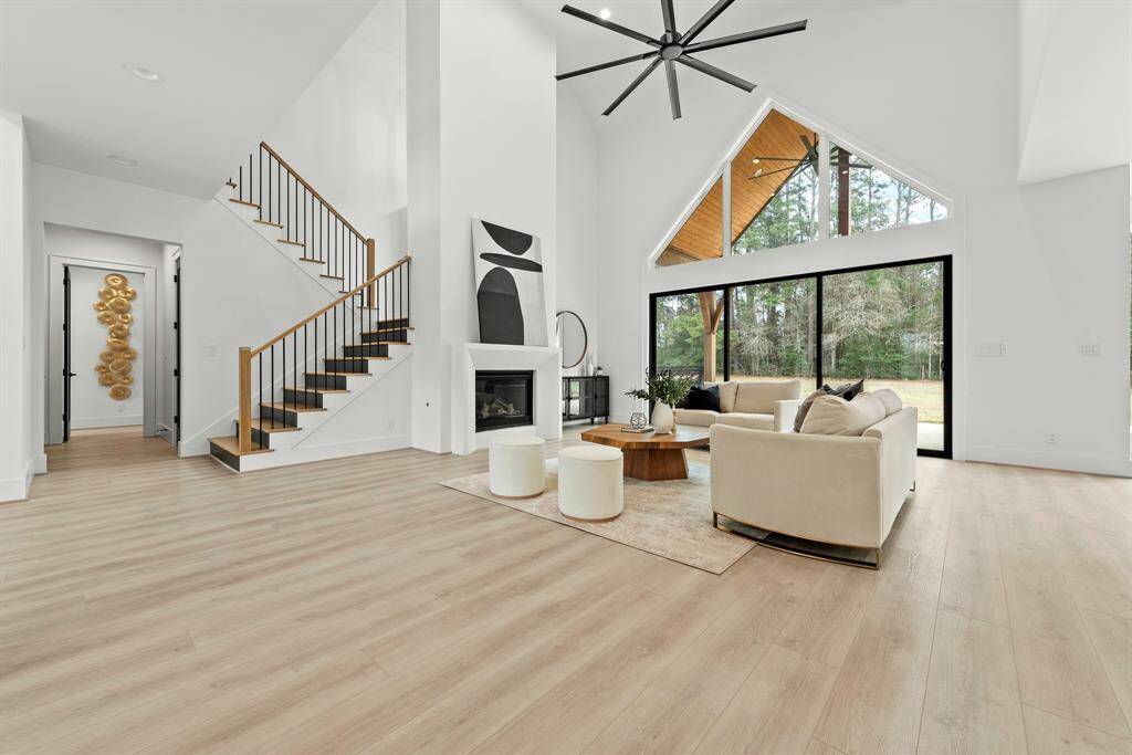 Two story living room/gas fireplace, sliding doors to back patio.
