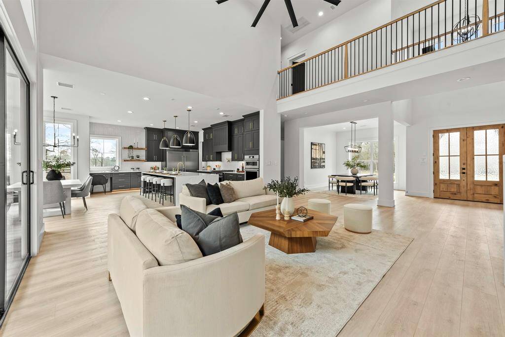 High ceiling great room with ample natural lighting.