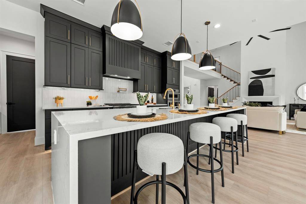 Ample Cabinet storage, under mount and toe kick lighting and waterfall island