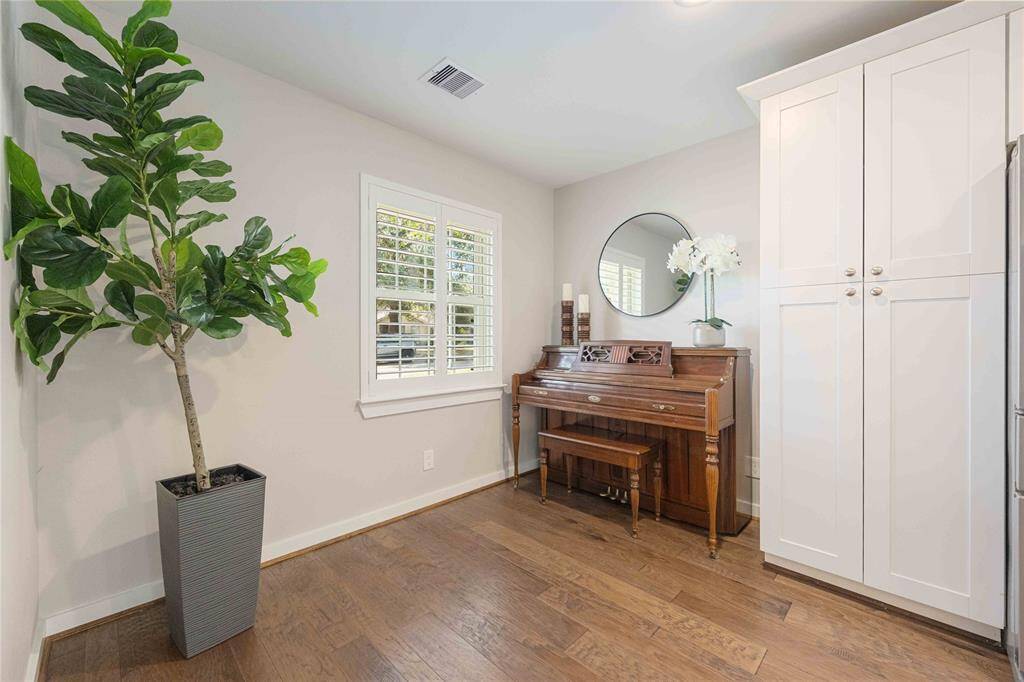 Enjoy this flex space near the kitchen, ideal for a small desk, a cozy reading are, or anything else that meets your style.