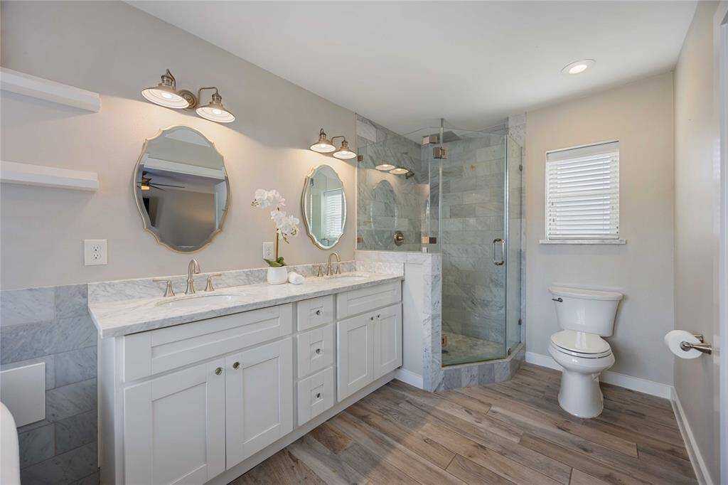 The primary bath boasts modern elegance. You'll love the renovations you see here.