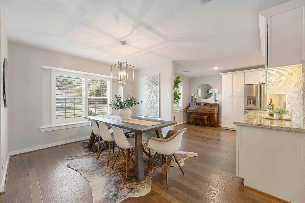 Transformed into an desirable open floor plan, this home boasts high ceilings, gorgeous engineered wood floors, and an abundance of natural light.