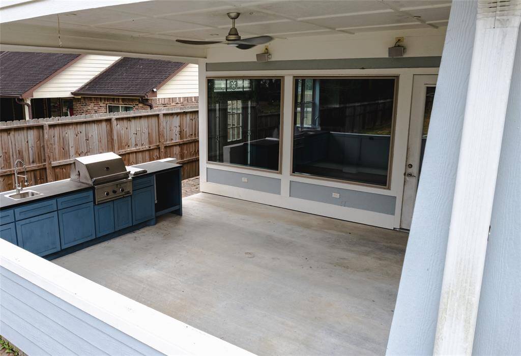 Covered outdoor kitchen area with covered patio