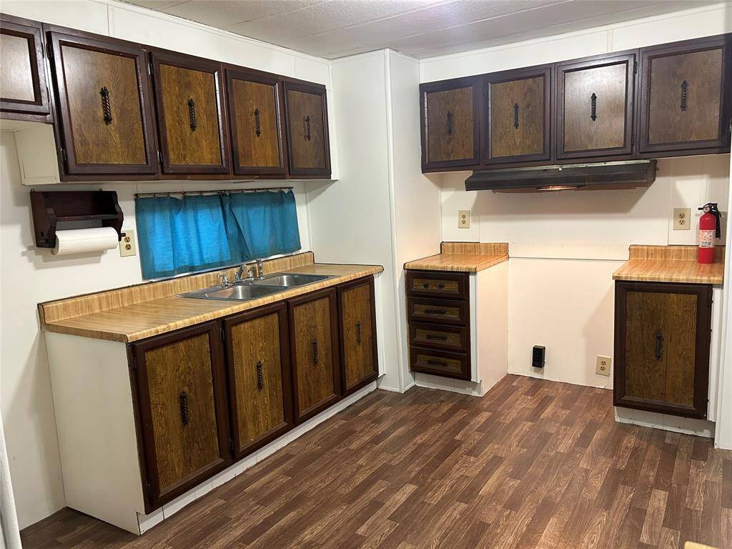 The kitchen has lots of cabinets