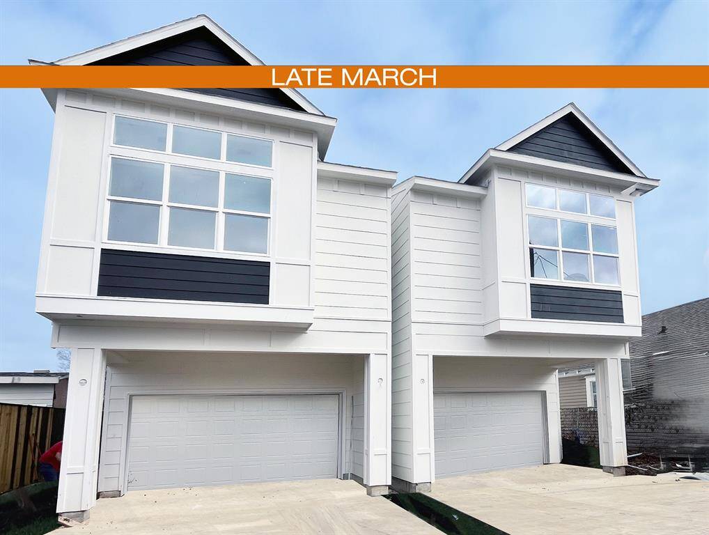 Modern home nearing completion, featuring large windows and a spacious design, perfect for natural light lovers. Ideal for those looking for a fresh start in a vibrant neighborhood.