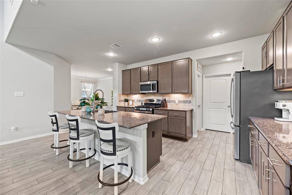 Lots of cabinets and counter space in this kitchen. There is filtered water available at the kitchen sink.