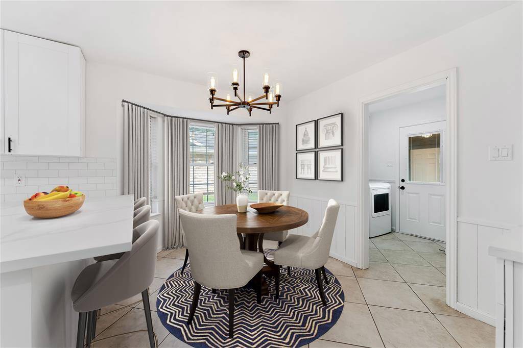 Staged view of your cute breakfast nook, roomy to add chairs to the island...