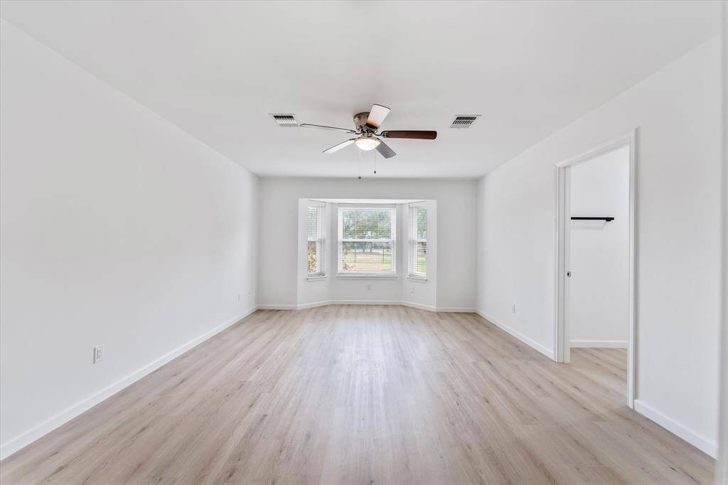 Spacious master suite...natural light, with gorgeous waterproof flooring