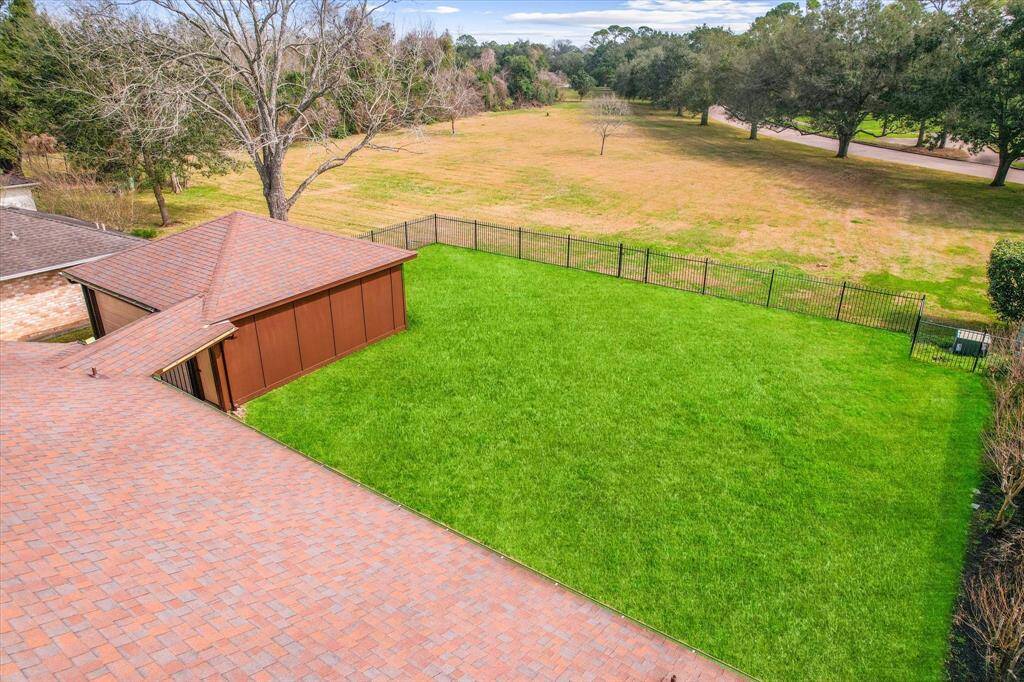Pristine & Lush backyard with views extending to adjacent park!