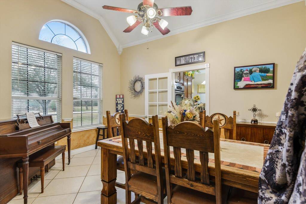 Formal dining room with door leading to kitchen.