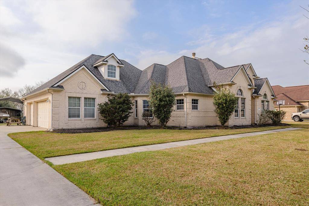 .72 acres with a custom-built home, inground pool, hot tub, RV barn, and AG barn.