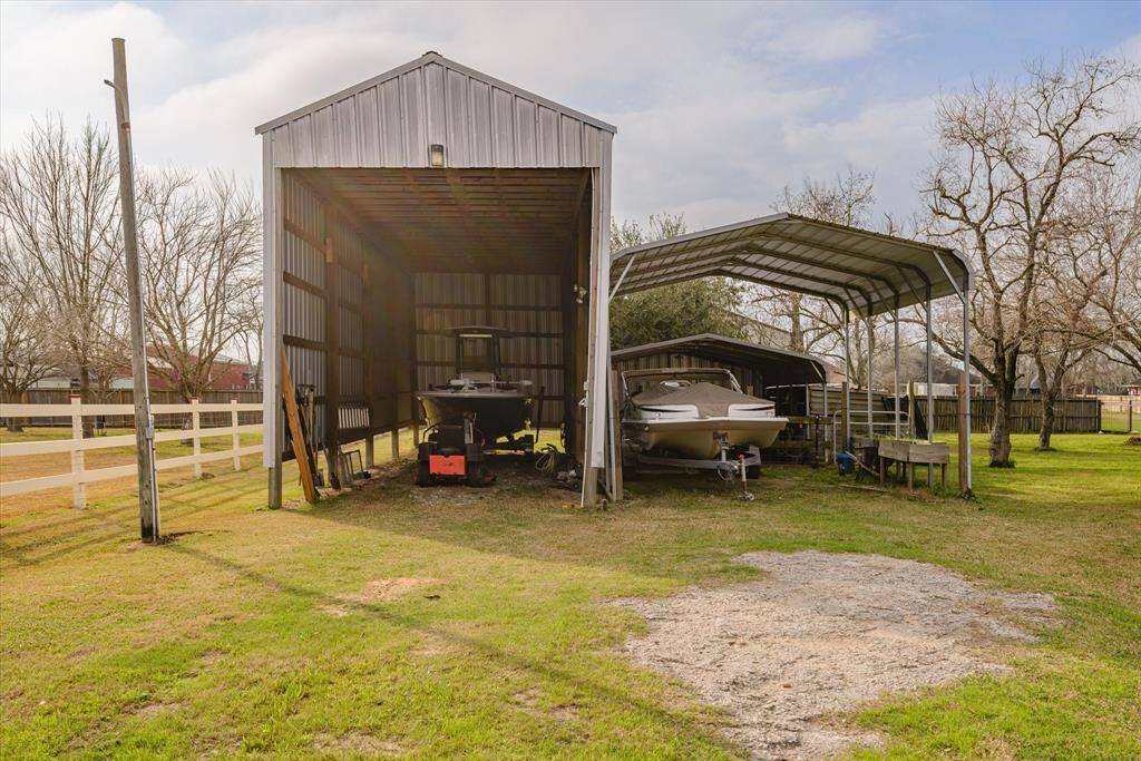 RV barn with electrical, carport area big enough for all the toys!
