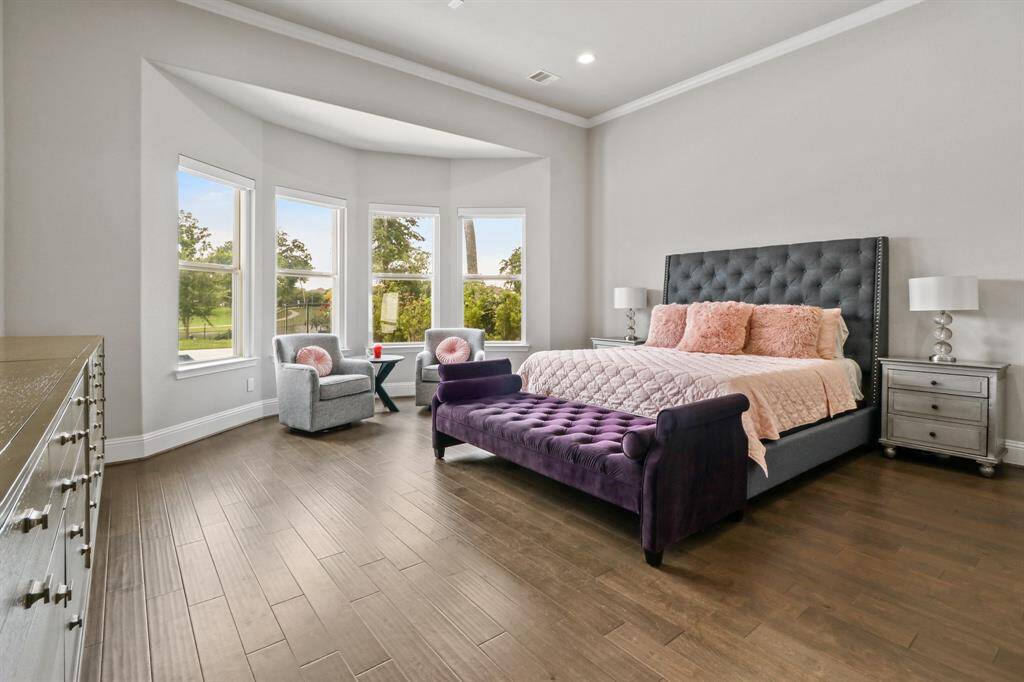 Enter the Prestigious Primary Suite, complete with Bay Window and extra room for seating, hardwood floors, tall ceilings and access to the Peaceful Primary Bath Oasis.