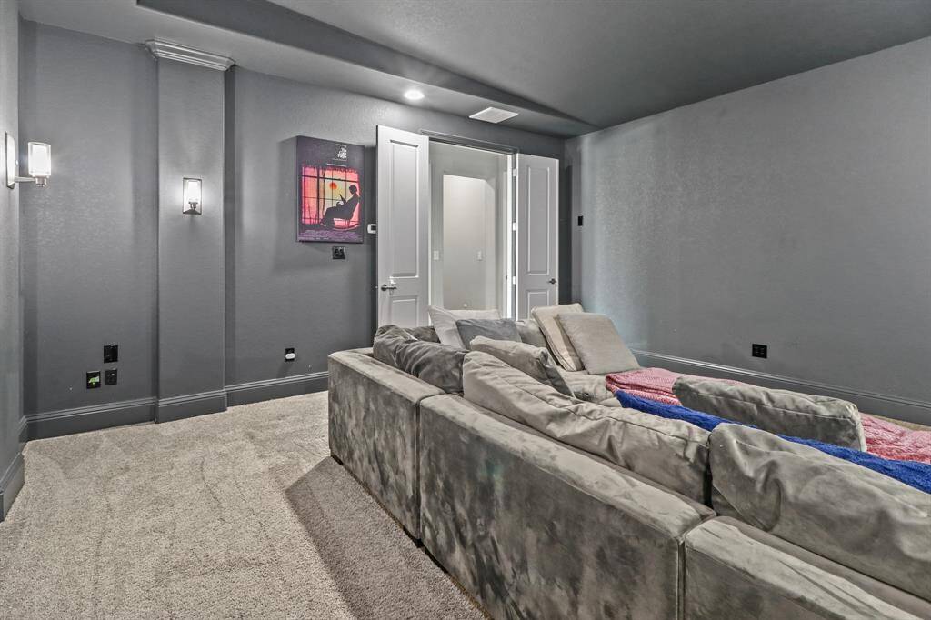 Enjoy movie nights with family and friends in this Magnificent Media Room, complete with slanted ceilings, theatre lighting and plush carpeting.