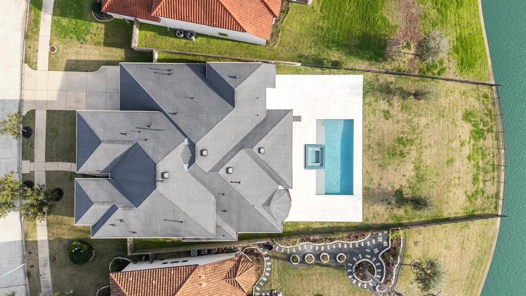 Overhead view shows the large lot which is 220 feet deep and LAKE FRONT, making for gorgeous water views.