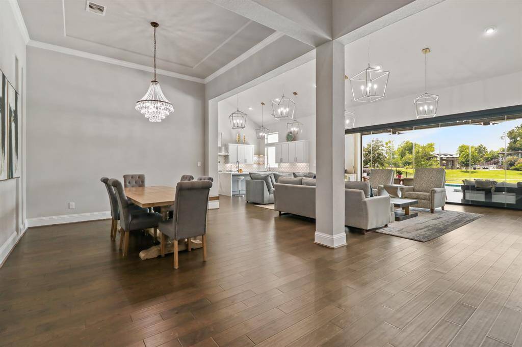 Gorgeous columns adorn the Divine Dining Room, which features handsome hardwood floors, tray ceilings, and ample room for your dinner party needs!