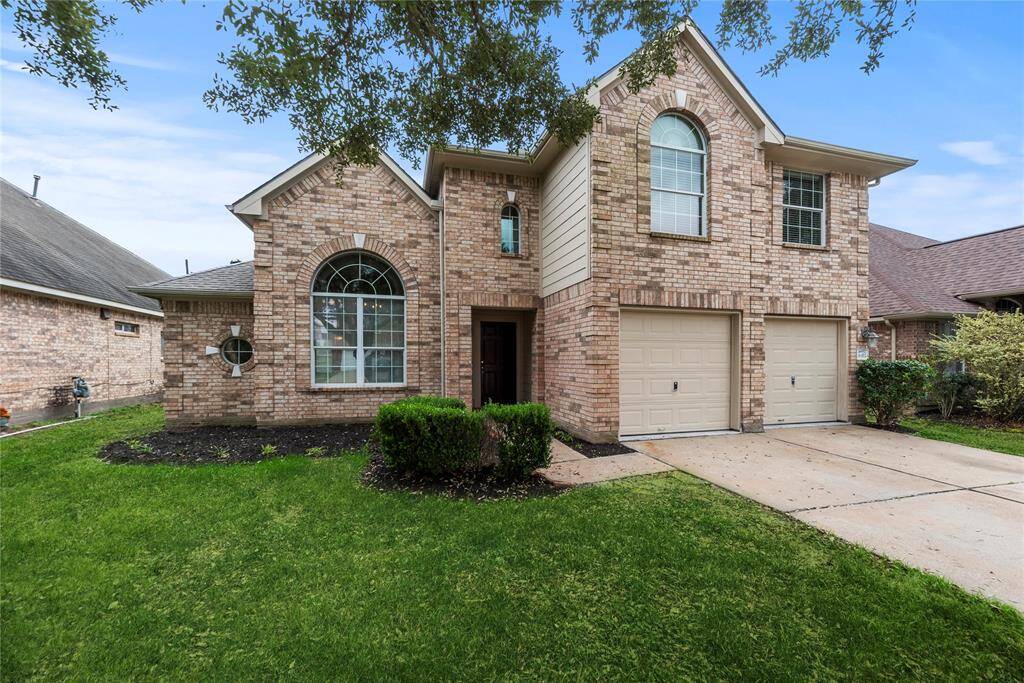 Welcome home to 6411 Briar Moss Lane in the esteemed Barker Village community!