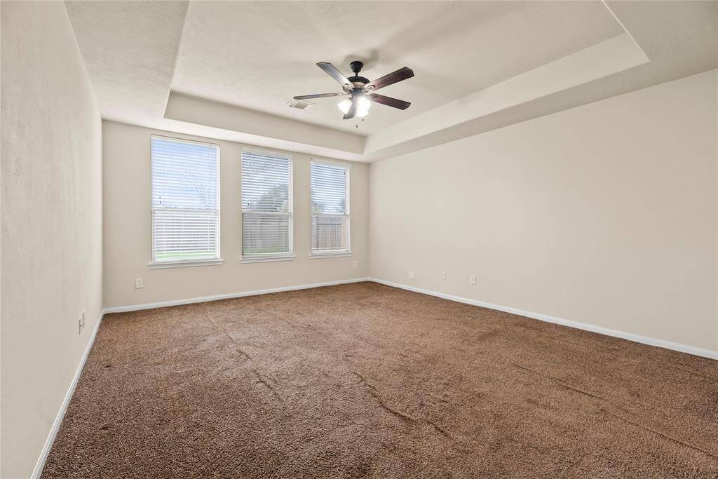 How perfect is this primary suite? Spacious and filled with natural light, this serene retreat offers the ultimate escape, promising comfort, tranquility, and pure relaxation.