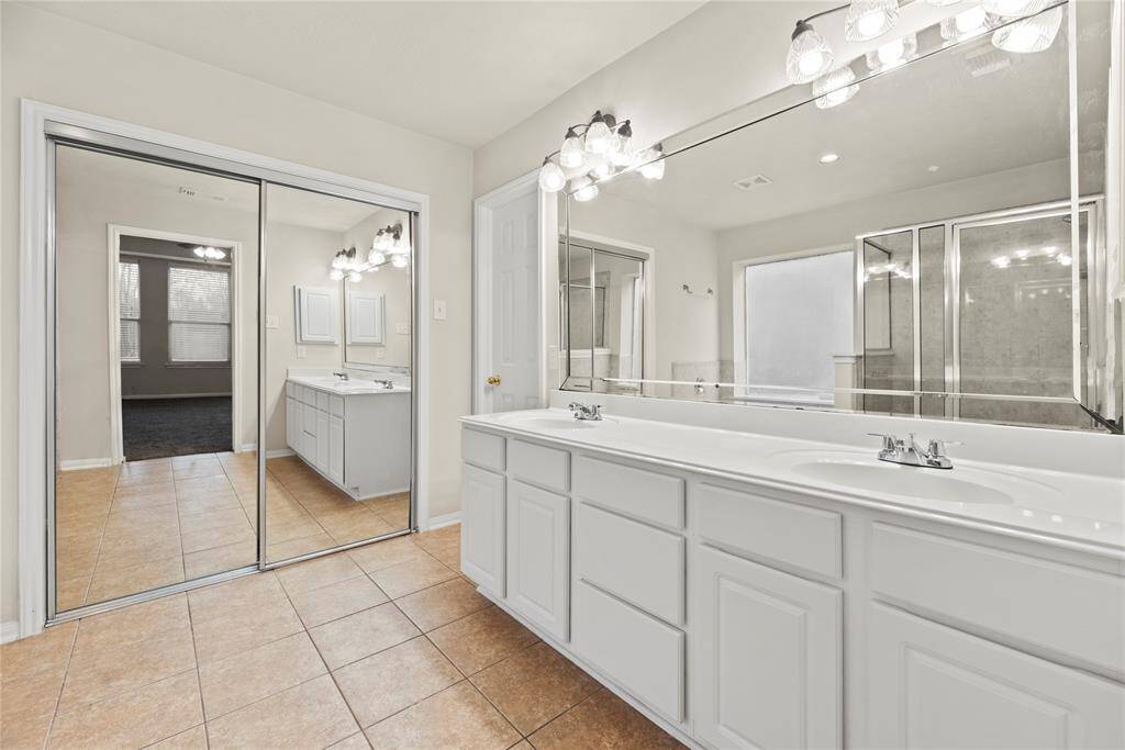 Dual vanities in your primary bath, offer personal space with tons of dedicated cabinet space.