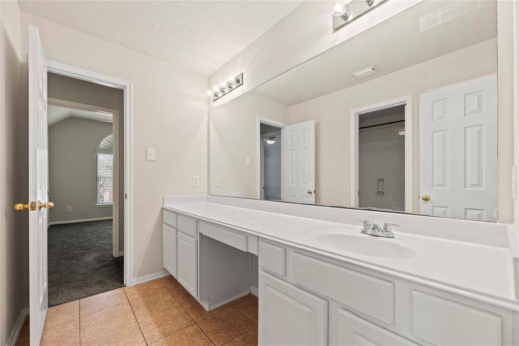 The large vanity with tons of storage in the upstairs secondary bath.