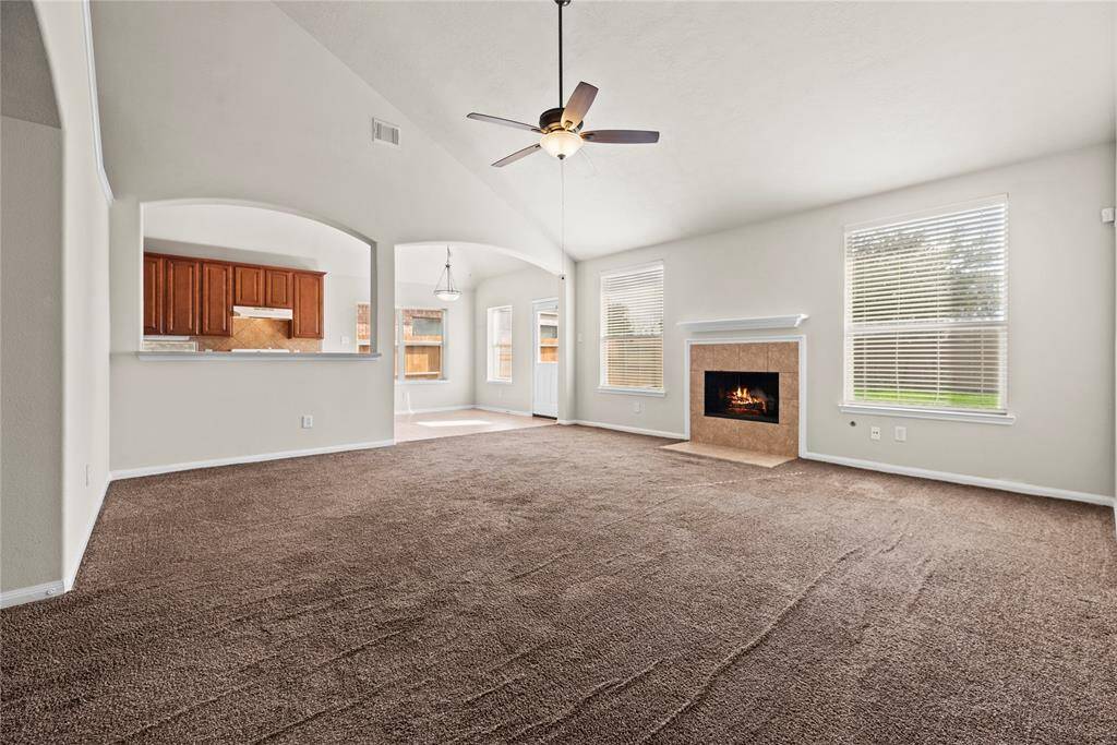This chic living room space has a great feel with tons of natural light coming from the wall of windows.