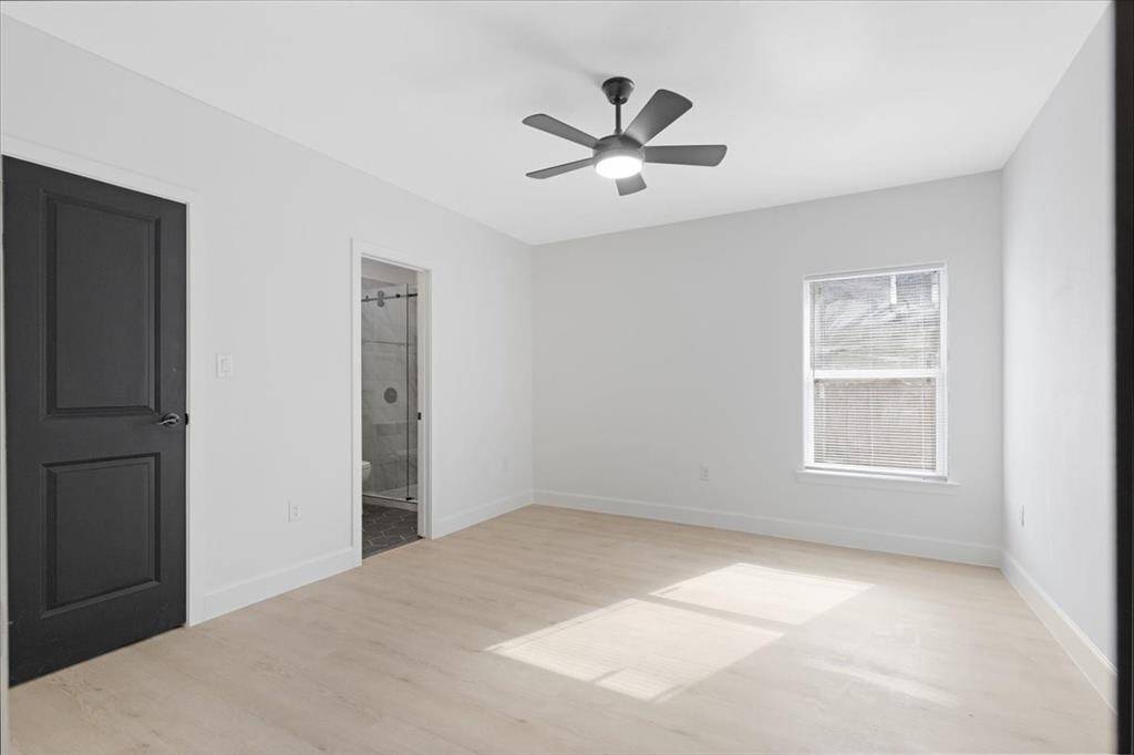 Spacious primary bedroom with a convenient walk-in closet.
