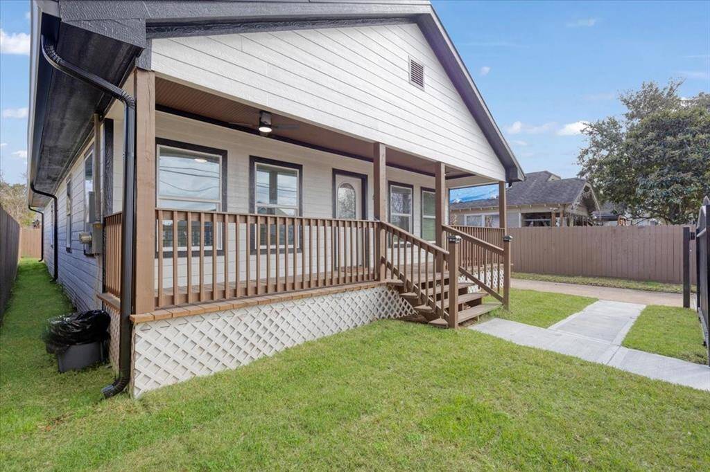 Charming front porch with elevated design, perfect for relaxation and curb appeal.
