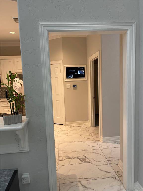 Built in security footage and screen in kitchen