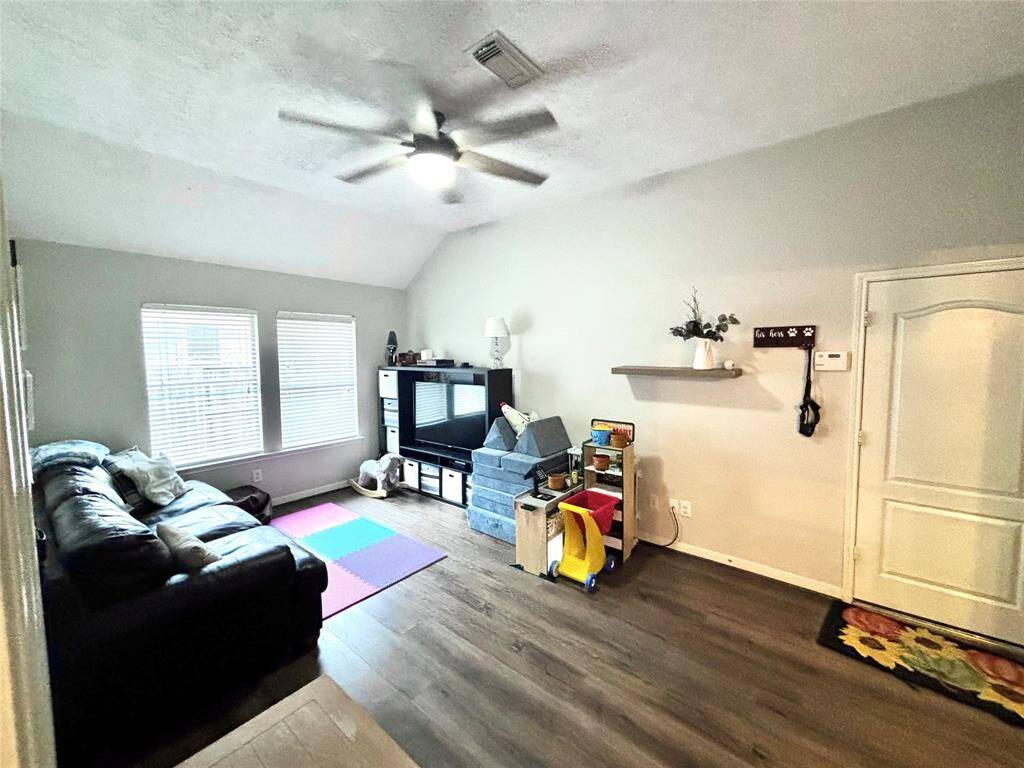 Extra long room between secondary bedrooms with endless options! The perfect space for the kids' playroom, seconday family room, sitting room, teen hangouts, and so much more!