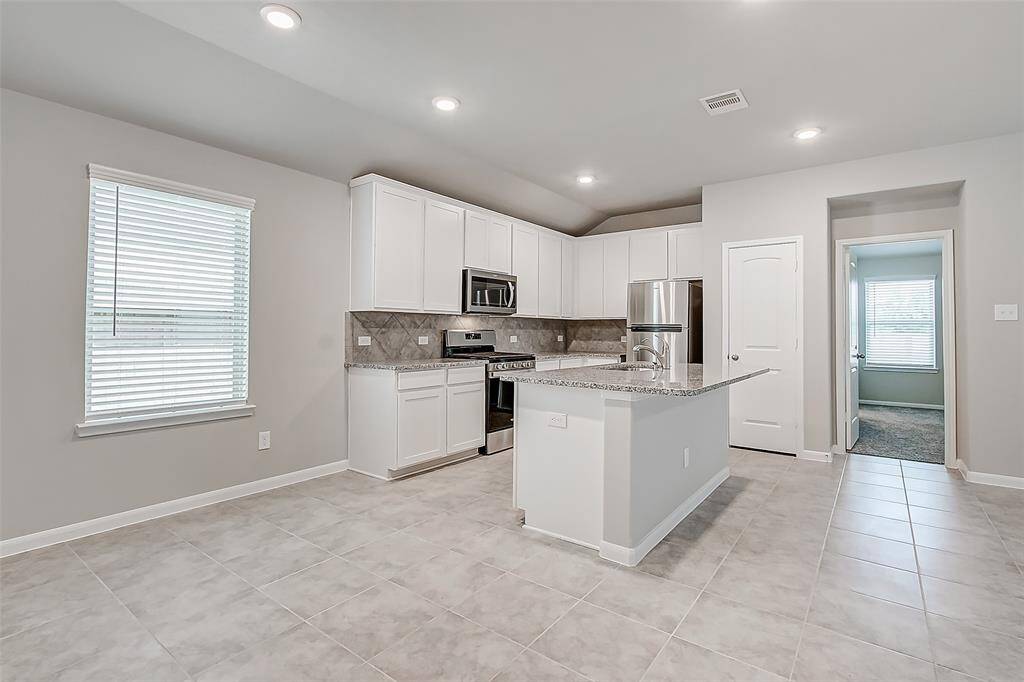 Breakfast area conveniently located adjacent to the kitchen.