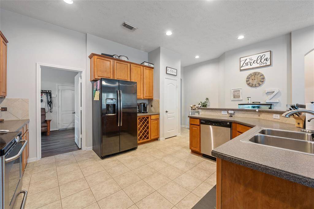 So much cabinet storage space, durable countertops, built-in wine rack, perfect spot for your coffee bar, under cabinet lighting and so much more! Talk about a FUNCTIONAL kitchen!