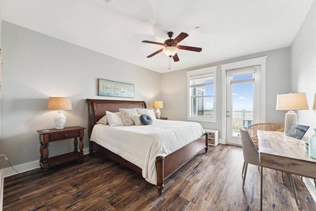 Spacious Primary with bay/sunset views, balcony access, and large ensuite bath.