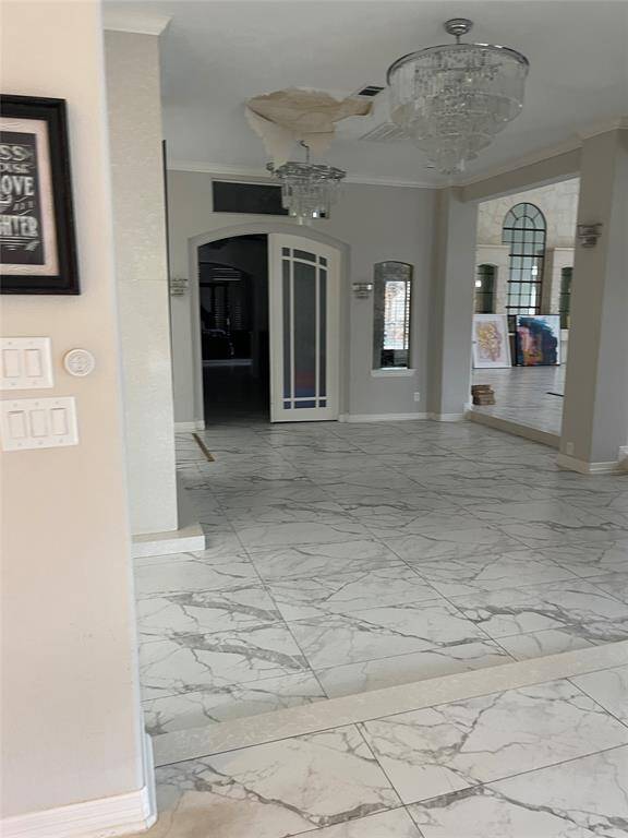 Foyer leading into living room and primary