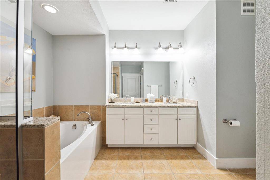Primary Bath with dual sinks, soaking tub, and separate shower.